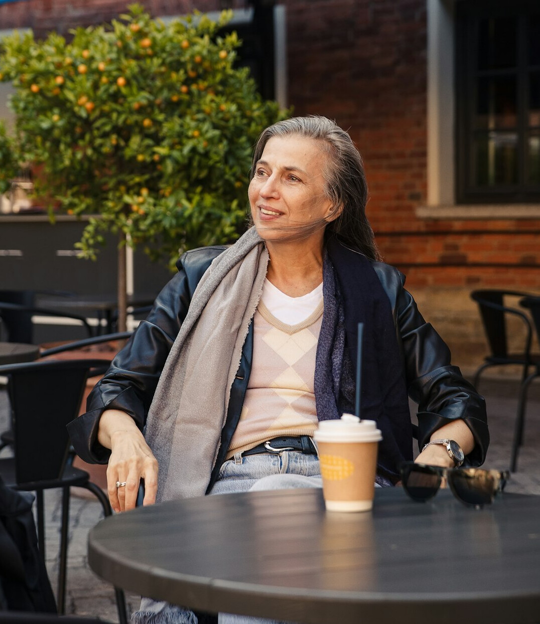 Portrait of a friendly senior woman with short gray hair smiling warmly