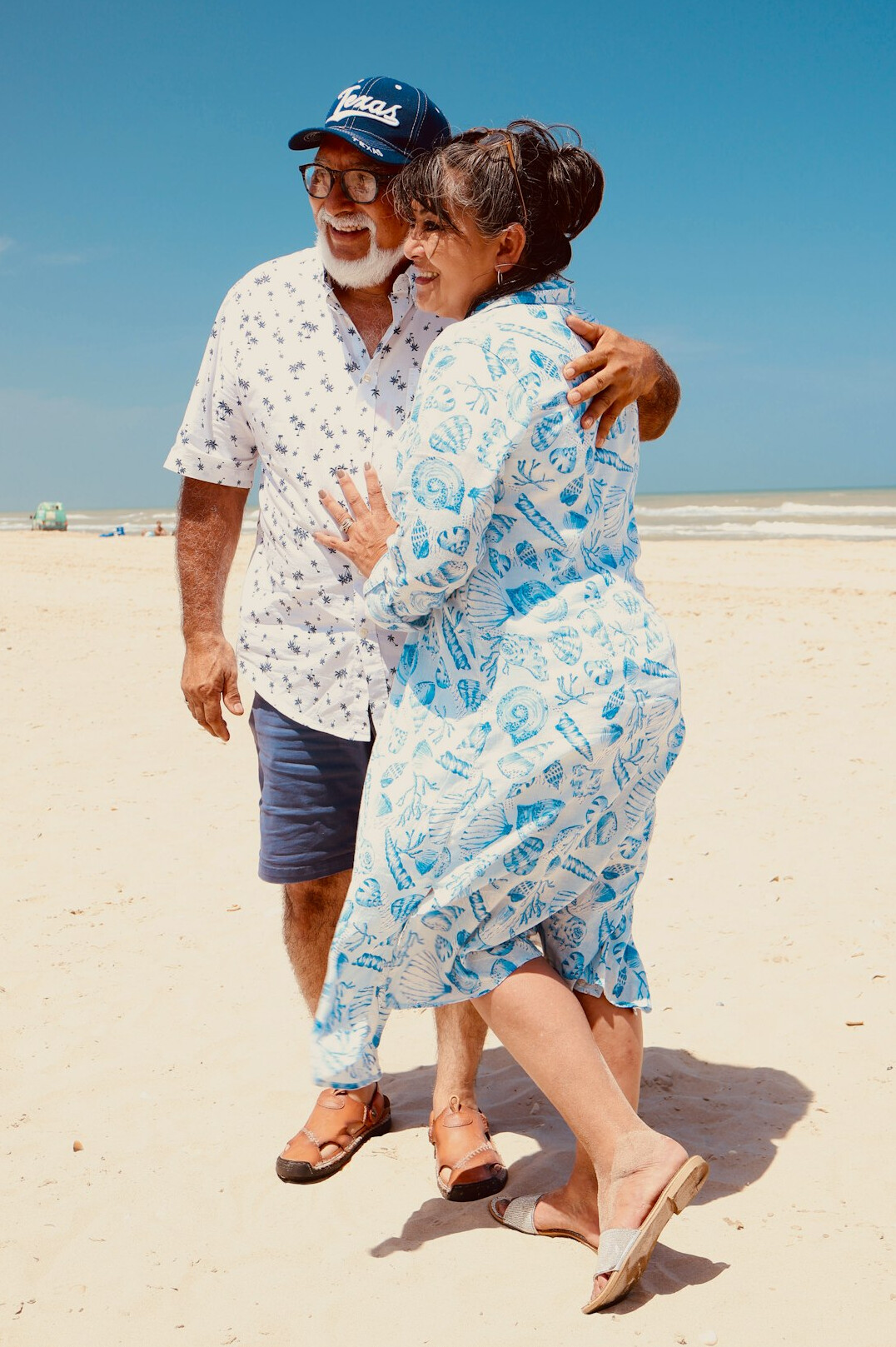 Elderly couple dancing happily in a community hall